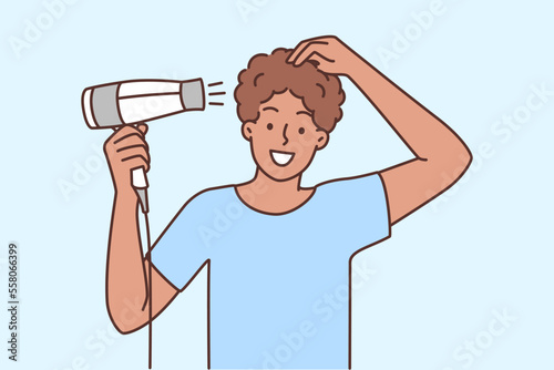 Man drying hair with dryer
