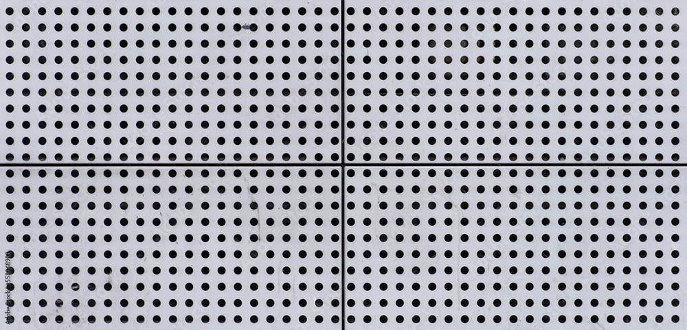 Old Rough Scratched Perforated Metal Steel Panel Surface Blocks with Small Round Holes Pattern. Old Rough Scratched Perforated Metal Steel Panel Surface Blocks with Small Round Holes Pattern.