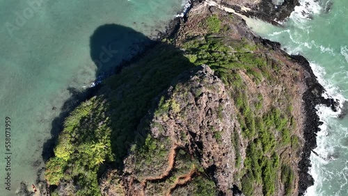 aerial drone overhead of chinamans hat in kaneohe hawaii oahu midday with beautiful blue ocean and tidepools overlooking island photo