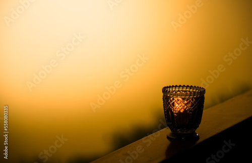Lanterns on a wooden balcony during sunset