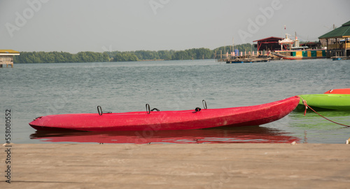 Red kayak on the sandy beach