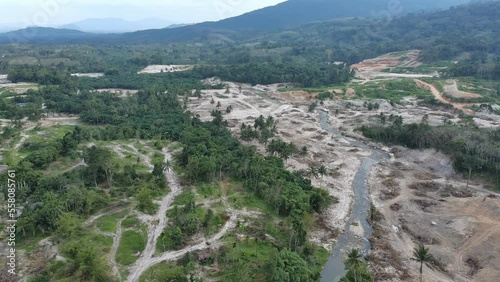 Aerial view of horrible deforestation for wood, logging, environmental destruction on mountain. Ecology concept change tree forest drought and forest refreshing, flying forward over a felled forest