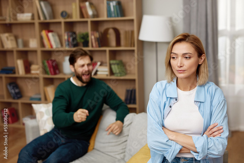 Couple Having Argument At Home. Angry Spouses Don\'t Speak With Each Other. Frustrated Husband And Annoyed Wife Quarrelling About Bad Marriage Relationships