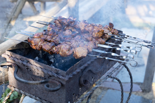 Cooking barbecue on a forged grill.