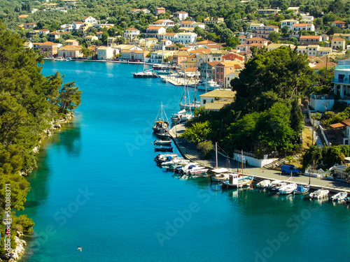 Yachts and boats in paxos harbour on the ionian greek island holiday resort. photo