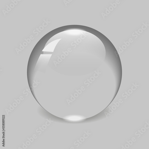 Round drop of water isolated on a grey background