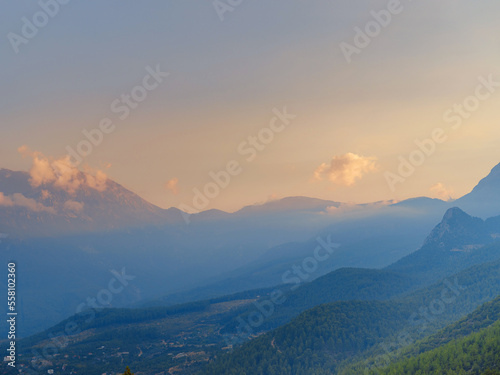 Turkey travel  mediterranean area on a warm summer day  sunset over mountains and valley under Kemer  Antalya province. Lycian trail