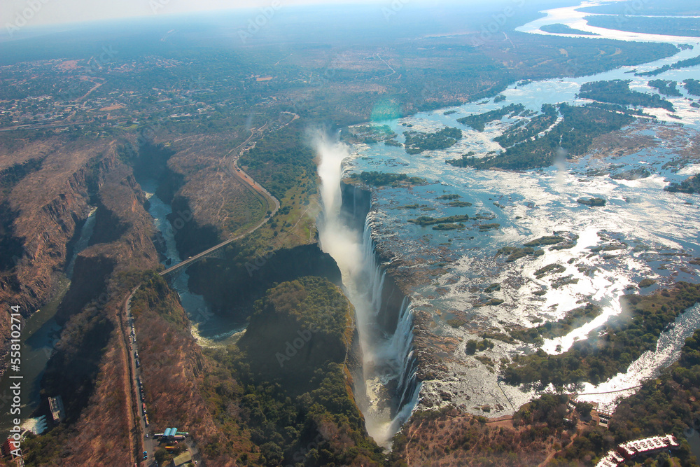 Wide river drops into deep gorge creating a waterfall