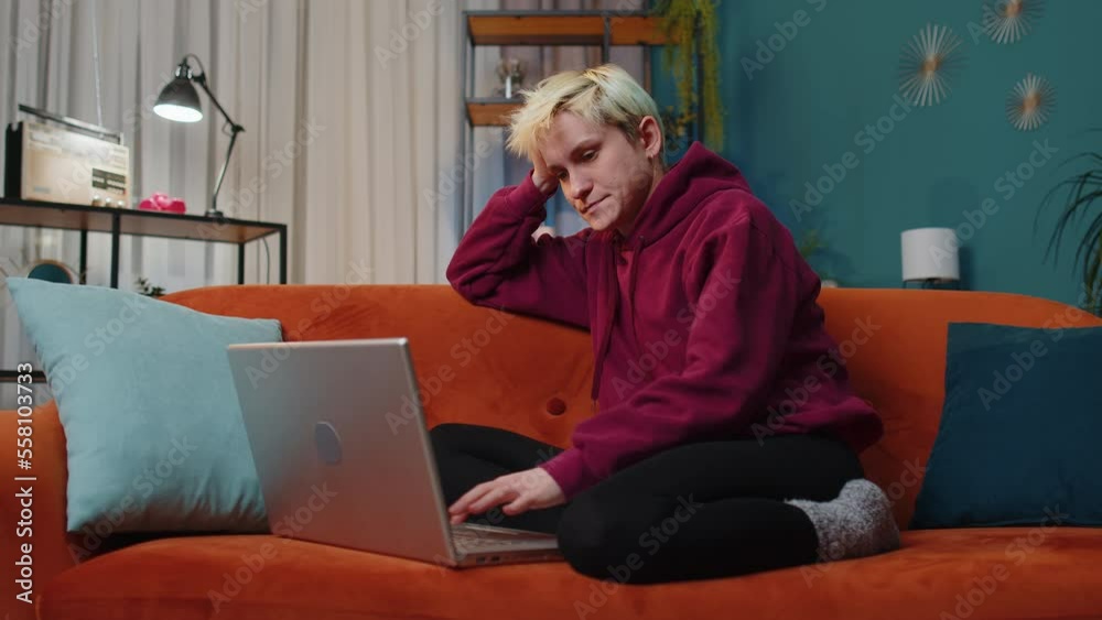 Tired young blonde woman freelancer use laptop, suffering from headache problem tension and migraine, stress at home. girl works on notebook, sends messages, makes online purchases, watching movies Tired young blonde woman freelancer use laptop, suffering from headache problem tension and migraine, stress at home. girl works on notebook, sends messages, makes online purchases, watching movies