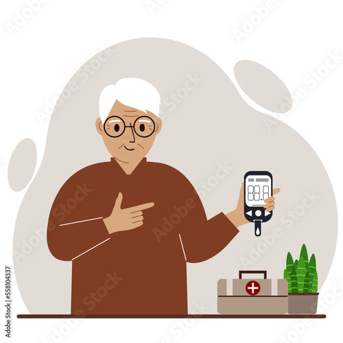 Happy old man holds a glucometer in his hand. The concept of blood sugar control, diabetic.