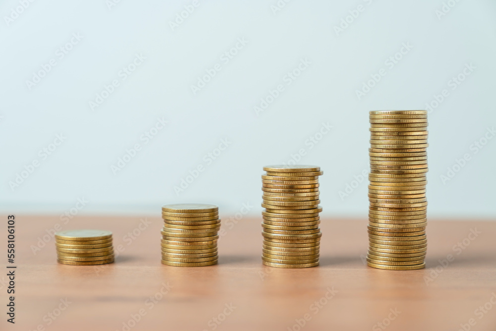 Coins on stack on table. concept saving money and financial growth. Coins on stack on table. concept saving money and financial growth.