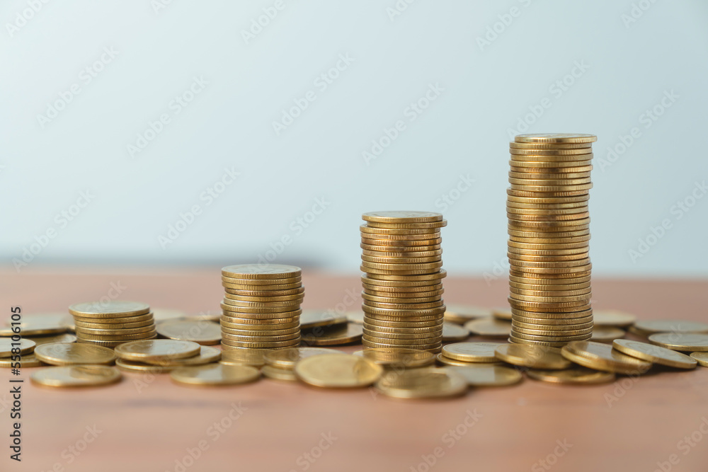 Coins on stack on table. concept saving money and financial growth. Coins on stack on table. concept saving money and financial growth.