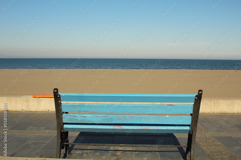 An alone bench in front of the sea view