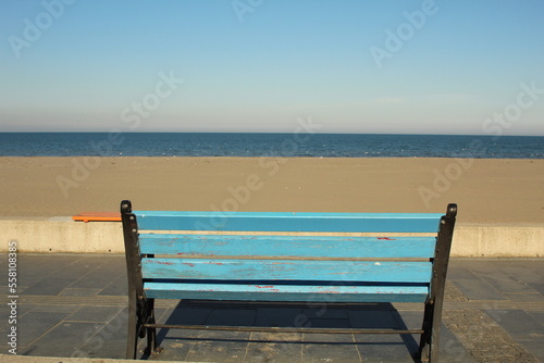 An alone bench in front of the sea view