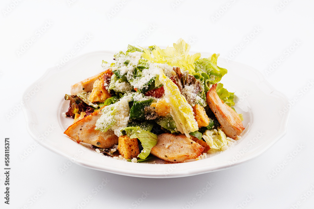 Traditional classic Caesar salad in white plate Traditional classic Caesar salad in white plate