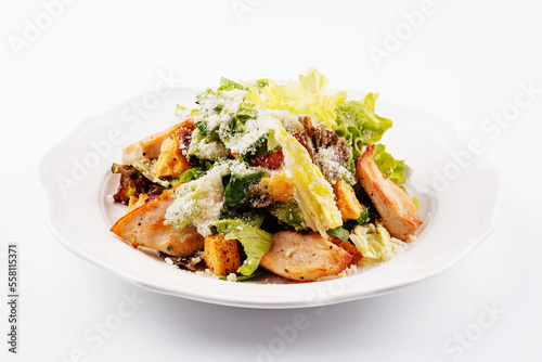 Traditional classic Caesar salad in white plate
