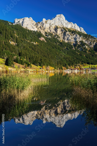 Lake Haldensee in the Tannheimer valley with mountain Rote Flüh in fall