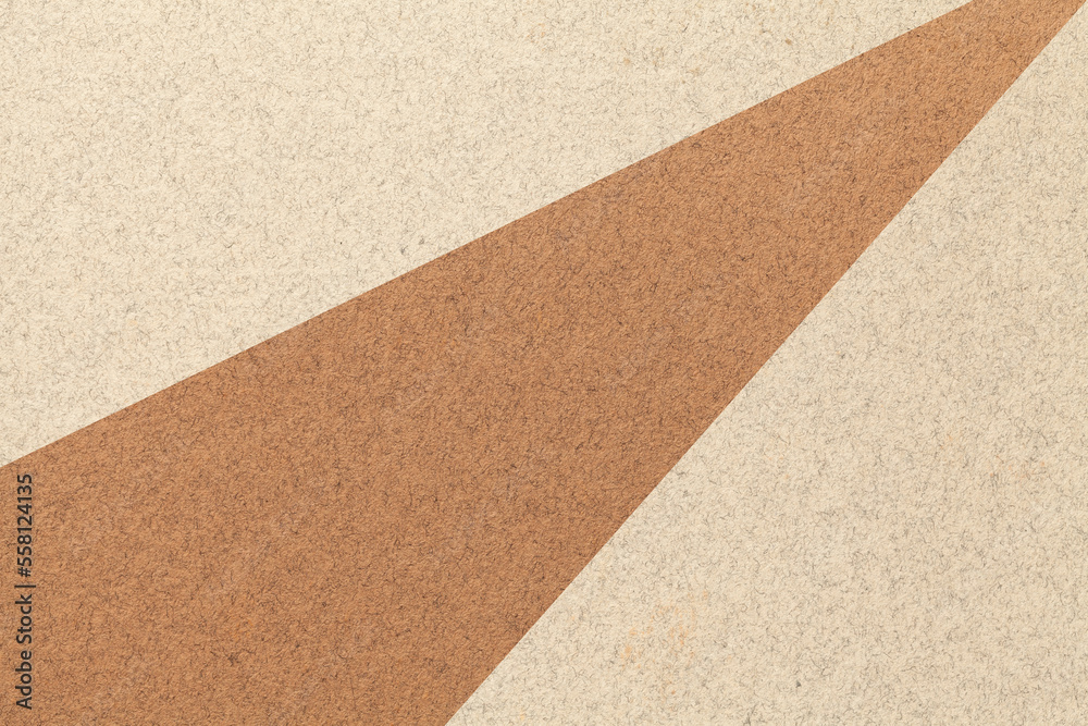 Texture of old craft beige and brown color paper background, macro. Structure of vintage abstract sand cardboard