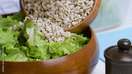  Mix Green Salad by Hand chef , job's tears,Crab Stick In glass bowl. Breakfast fresh salad and clean vegetable can eat raw. Salad mix leaves green vegetable 