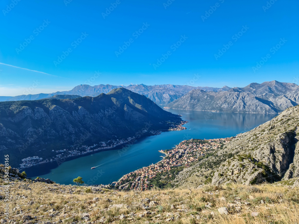 Panoramic view of the bay of Kotor in summer, Adriatic Mediterranean Sea, Montenegro, Balkan Peninsula, Europe. Fjord winding along the coastal towns. Lovcen and Orjen mountain range, Dinaric Alps