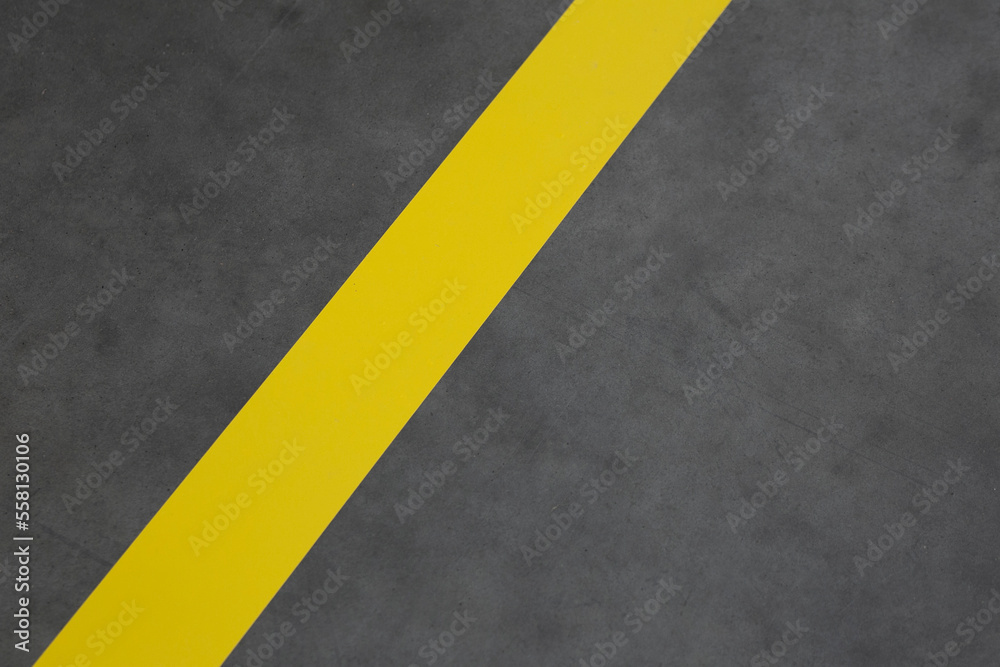 bright yellow stripe on the concrete floor bright yellow stripe on the concrete floor