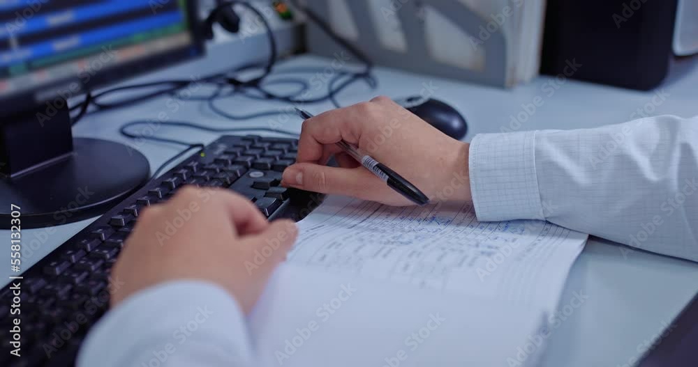office worker filling out project documentation, closeup of hands at table, work with PC, 4K, Prores