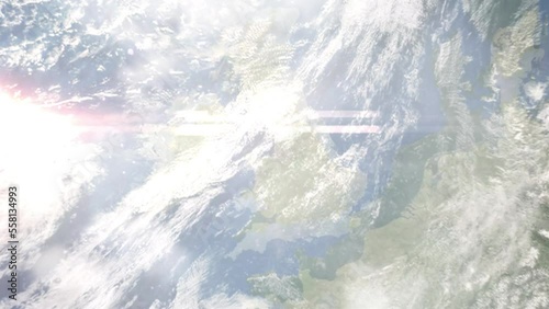 Earth zoom in from outer space to city. Zooming on Birkenhead, UK. The animation continues by zoom out through clouds and atmosphere into space. Images from NASA photo