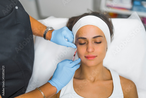 A woman receiving a collagen injection. High-angle shot. Aesthetic medicine concept. Beauty concept. High quality photo
