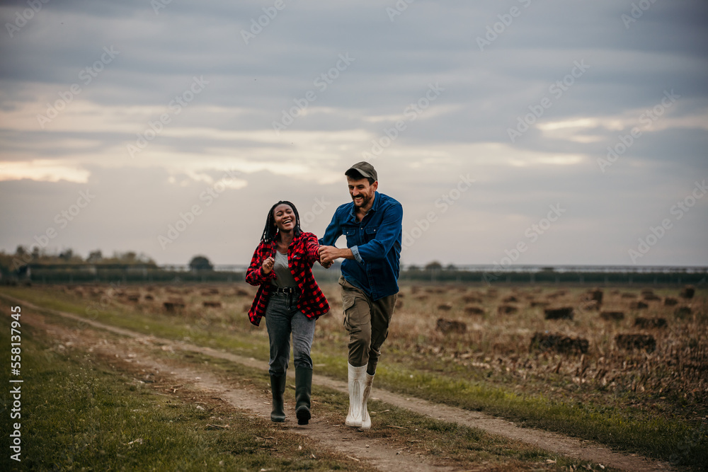 Shot of a loving young couple having fun outdoors in a grass field. Man and woman enjoying a day in a meadow. Shot of a loving young couple having fun outdoors in a grass field. Man and woman enjoying a day in a meadow.
