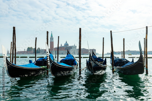 Gondolas in Venice, Italy. Water parking for boats. © PhotoHunter