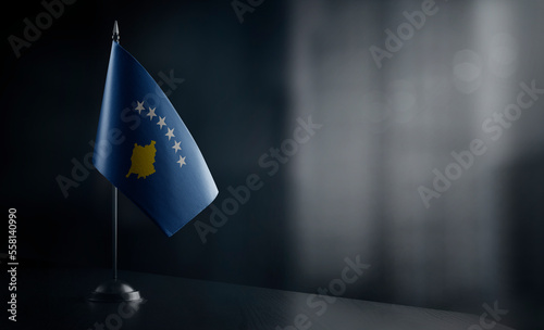 Small national flag of the Kosovo on a black background