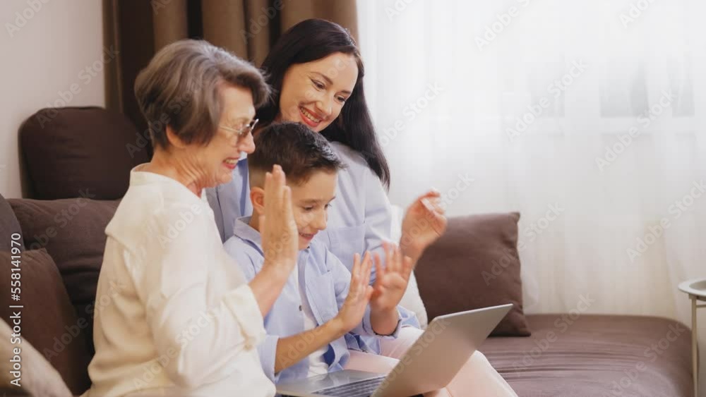 Multigenerational family having video call on laptop, online communication Multigenerational family having video call on laptop, online communication