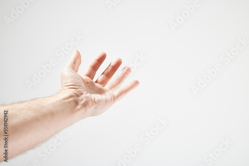 Male hand in front of white background