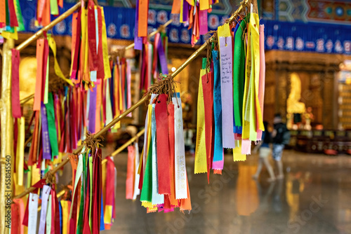 Wish ribbons in Buddhist temple in Kek Lok Si temple, George Town, Penang, Malaysia. Translation: Love, Money, Success