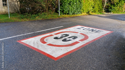 30km/h speed limit traffic road sign painted on the road photo