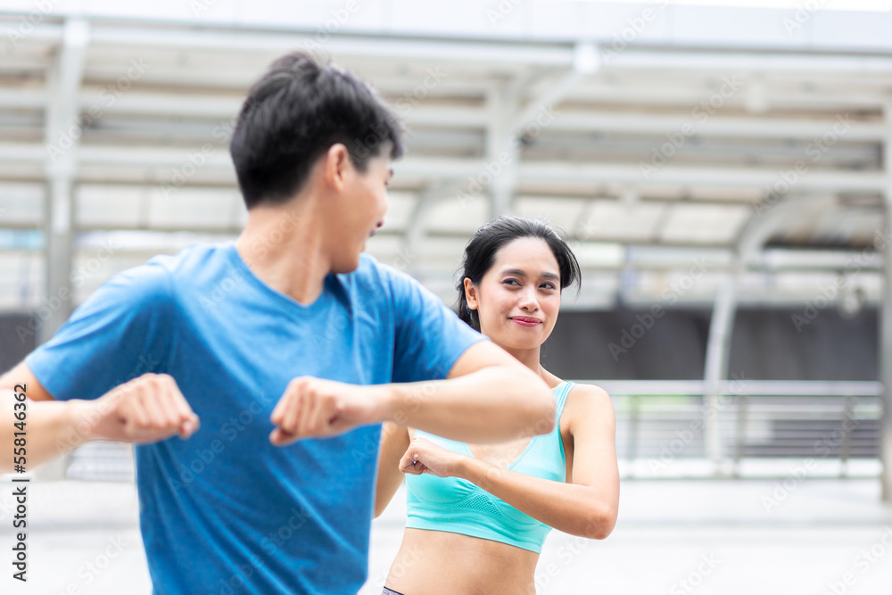 happy and healthy man and woman athlete runner exercise warm up together before outdoor jogging and running workout or run in city