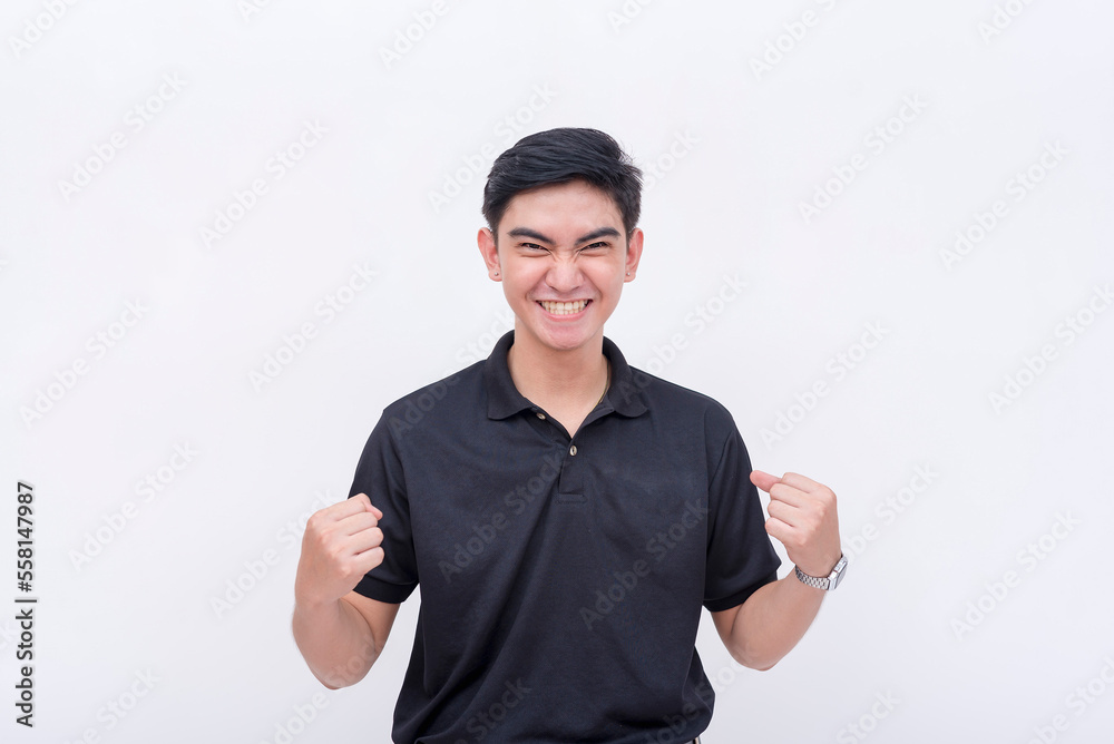 An happy young man feeling vindicated. Passing an exam or getting promoted. Isolated on a white backdrop. An happy young man feeling vindicated. Passing an exam or getting promoted. Isolated on a white backdrop.