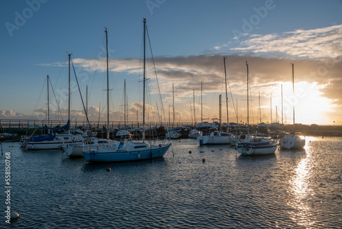 sun setting over the boats in the marina at Hill Head Hampshire England
