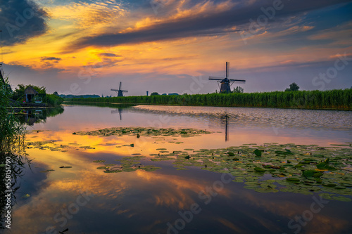 Sunset above old dutch windmills in Kinderdijk, Netherlands