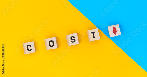 Wooden block cubes flipping cost to down. Cost down for more profit concepts