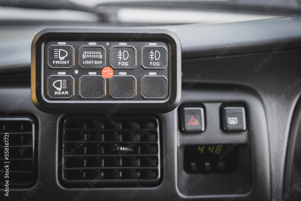 Third-party control panel in the car interior to control external mounted additional lighting. Car light tuning. Third-party control panel in the car interior to control external mounted additional lighting. Car light tuning.