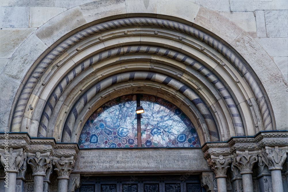 Main entrance of famous protestant church Great Minster at the old town of Zürich on a cloudy autumn day. Photo taken November 4th, 2022, Zurich, Switzerland.