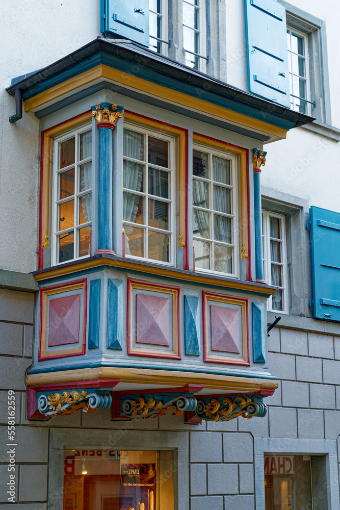 Fototapeta premium Beautiful colorful wooden oriel at historic house at the old town of Zürich on a cloudy autumn day. Photo taken November 4th, 2022, Zurich, Switzerland.