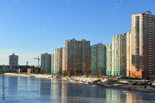 New buildings on snow-covered embankment of Moskva river in winter. Moscow  Russia