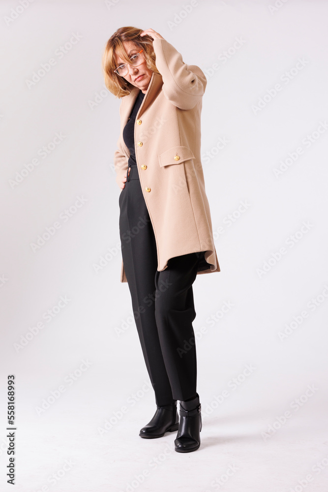 Executive blonde model over 50 years in photo studio Executive blonde model over 50 years in photo studio