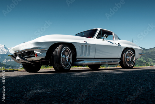 This classic American muscle car with a white paint job is pristine, powerful lines are sure to turn heads. With its iconic design, it's perfect for adding a touch of classic style to your project