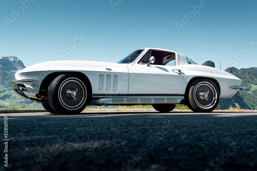 This classic American muscle car with a white paint job is pristine, powerful lines are sure to turn heads. With its iconic design, it's perfect for adding a touch of classic style to your project