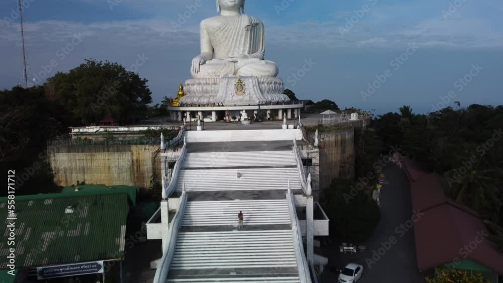 Temple built on the hill in form of huge Buddha meditating in lotus position filmed by drone. Popular tourist religious landmark in Thailand. Sculpture of god in Thailand filmed from the air Temple built on the hill in form of huge Buddha meditating in lotus position filmed by drone. Popular tourist religious landmark in Thailand. Sculpture of god in Thailand filmed from the air
