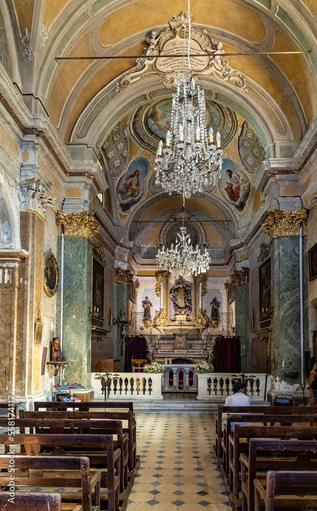 Main nave and presbytery of Our Lady Assumption church, Notre Dame de l’Assomption in historic old town of Eze on Azure Cost of Mediterranean Sea in France
