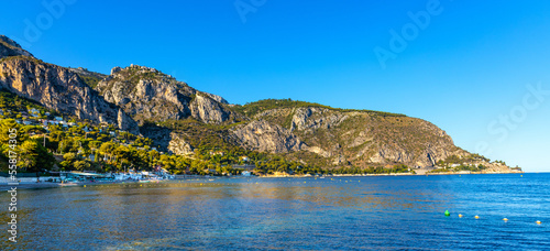 Panoramic view of Alpes mountains and slopes with Cap Estel Cape over Eze sur Mer resort town and beach on French Riviera Coast of Mediterranean Sea in France photo